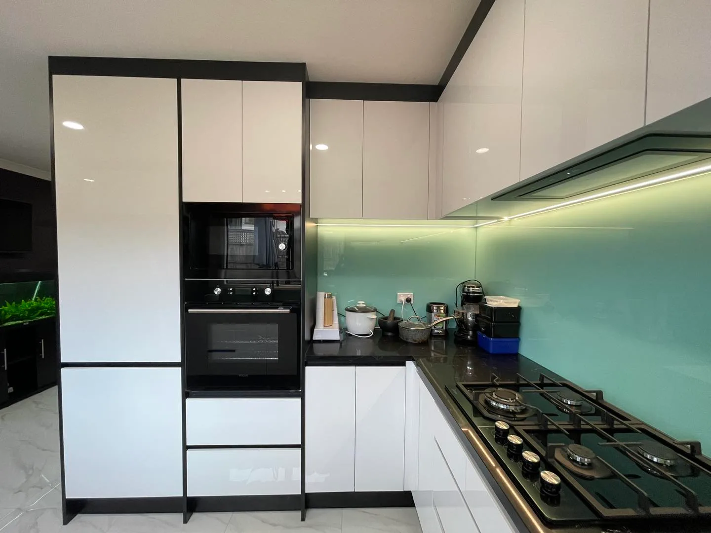 Contemporary black and white kitchen renovation with island bench